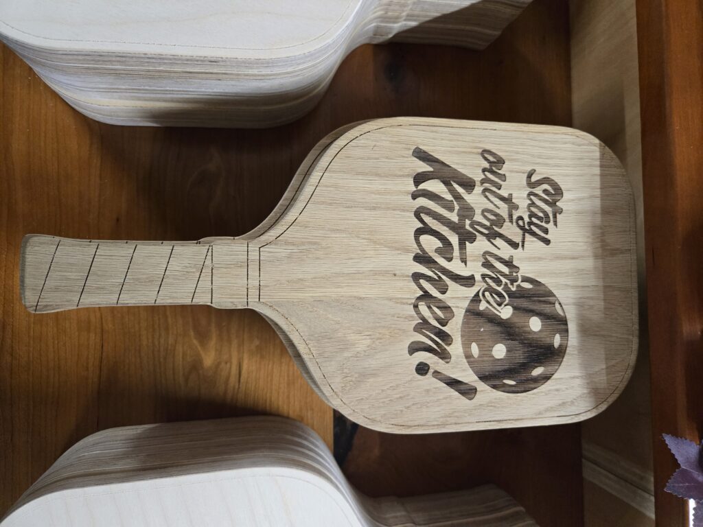 Unique engraved pickleball paddle.