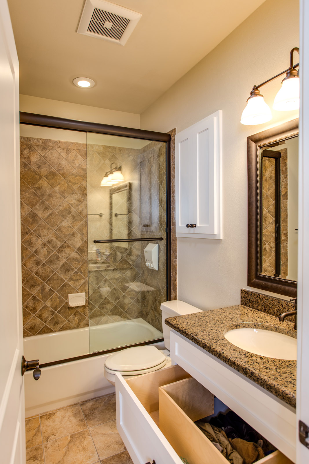 Secondary bathroom showing open drawer