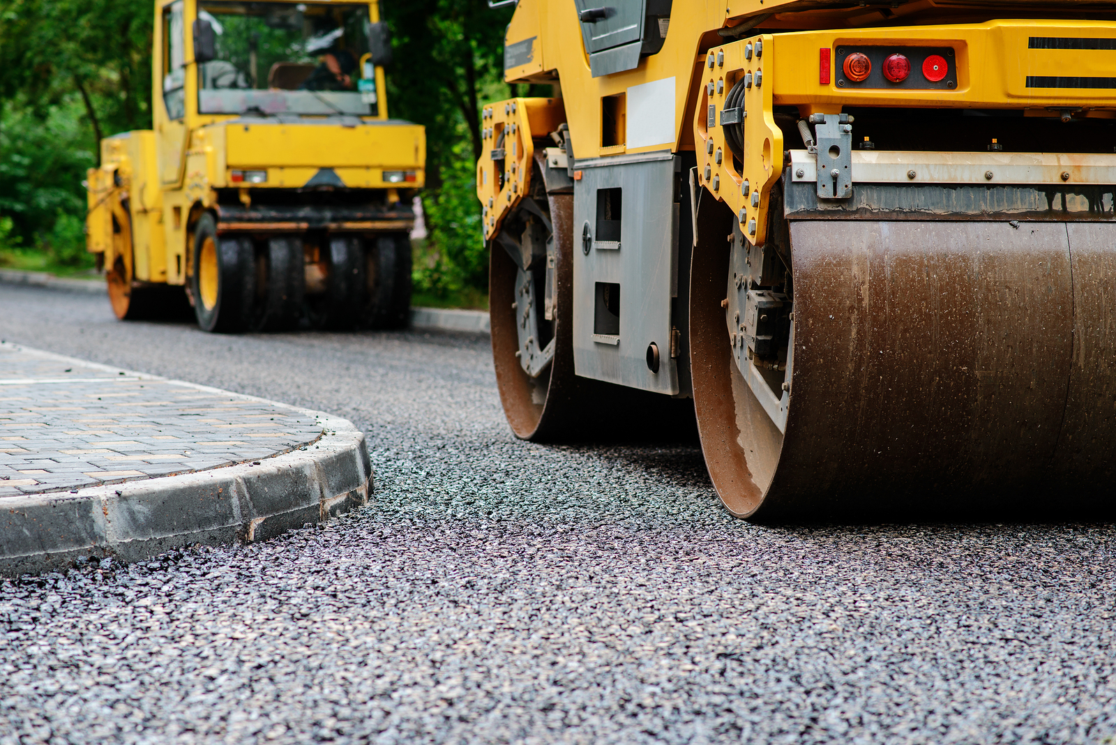 Background Of Asphalt Roller That Stack And Press Hot Asphalt. R Background of asphalt roller that stack and press hot asphalt. Road repair machine.
