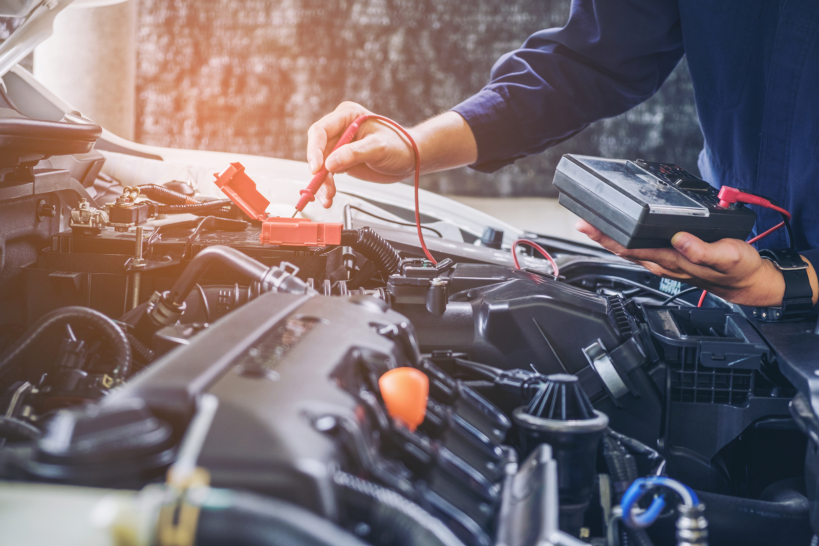 Hands Of Car Mechanic Working In Auto Repair Service. Hands of car mechanic working in auto repair service.